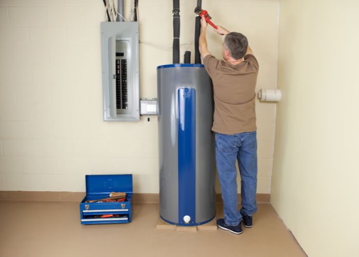 plumber fixing water heater